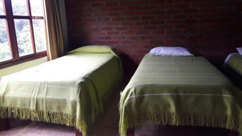 Ecuador: beds at the accommodation in Chiriboga